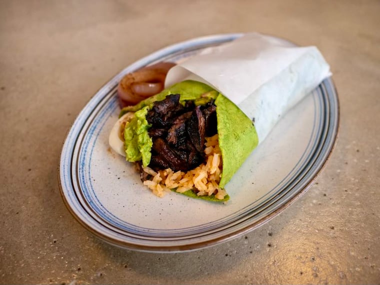 El Chingon's enormous taco placero, a plate-sized taco with your choice of protein, served on a handmade tortilla of the day.