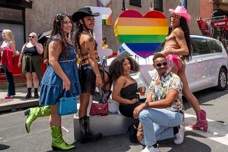 Friends from Manayunk pose for a selfie in the Gayborhood as thousands of people celebrate queerness and the start of Pride Month at the Pride March and Festival in Center City Sunday, June 4, 2023.