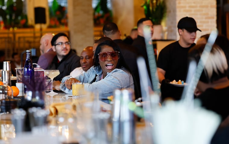 Guests at the bar at Mamajuana Cafe, a new sultry Latin-inspired restaurant in Fishtown.