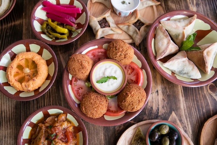 An array of Mezza dishes, both cold and hot, sit on a table at Li Beirut restaurant in Collingswood, NJ on Tuesday, March 23, 2021. Li Beirut is a new Lebanese restaurant on Collings Avenue.