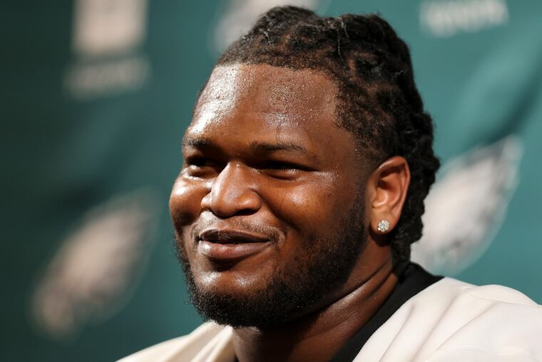 Eagles defensive tackle Jalen Carter talking with reporters at the NovaCare Complex in May. 