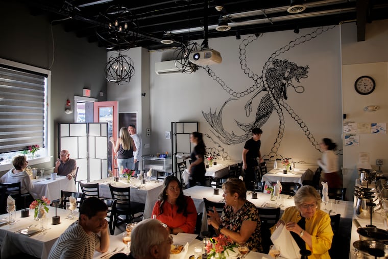 A large mural fills the wall at Jules@Market in Bristol, Pa. on Wednesday, Sept. 11, 2024.