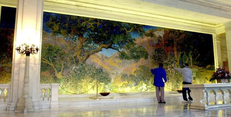 The "Dream Garden" was created by artist Maxfield Parrish in collaboration with Louis Comfort Tiffany for Cyrus Curtis' 1910 headquarters.