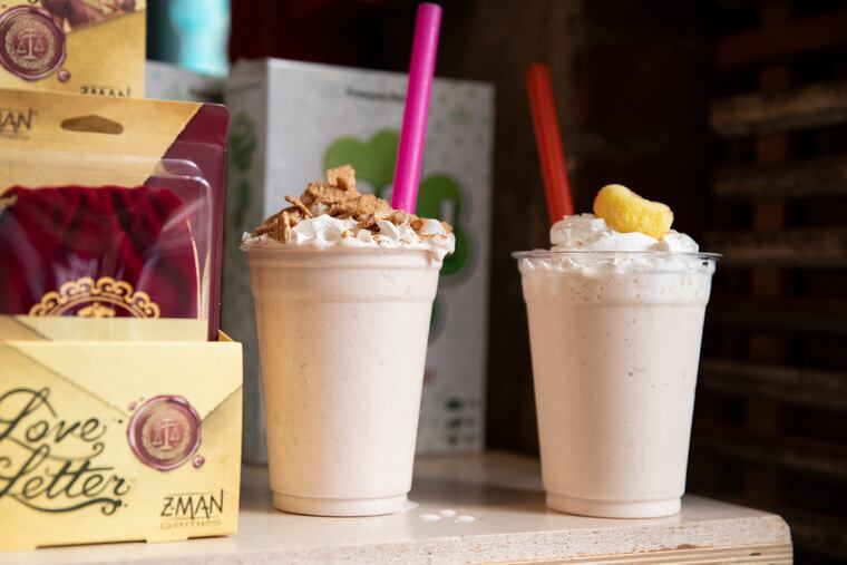 Cinnamon Toast milkshake (left) and the Georgia Peach Iced Tea boozy milkshake at Thirsty Dice in Philadelphia on June 7, 2023.