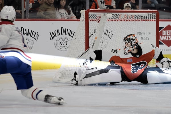 Flyers goalie Aleksei Kolosov makes a tough save on a shot by Montreal's Cole Caufield in the second period Sunday night. 