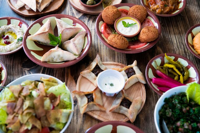 An array of mezze dishes, both cold and hot, sit on a table at Li Beirut restaurant in Collingswood, N.J. on March 23, 2021. Li Beirut is a new Lebanese restaurant on Collings Avenue.