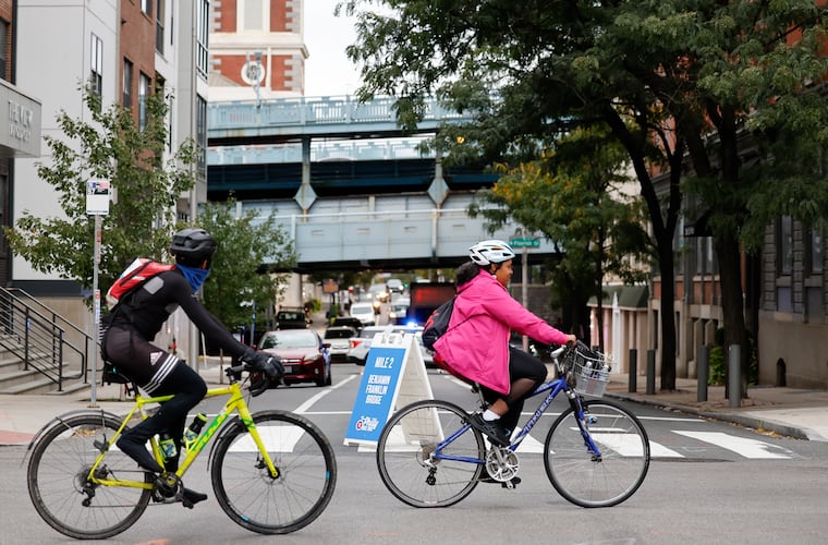 Philly Bike Ride 2023 participants ride in the intersection of Fourth and Race Streets in Old City on Saturday morning, October 14, 2023.  The event celebrates cycling and riding in the city in a car-free environment.