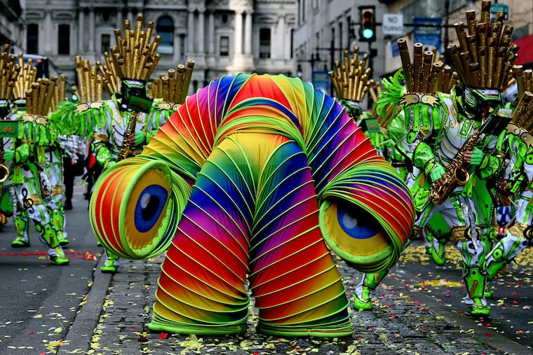 A headless “Slinky” space alien marches with first place-winning South Philadelphia String Band, during its “Circus Space-Tacular” performance on South Broad Street during the Mummers Parade Jan. 2, 2022. 