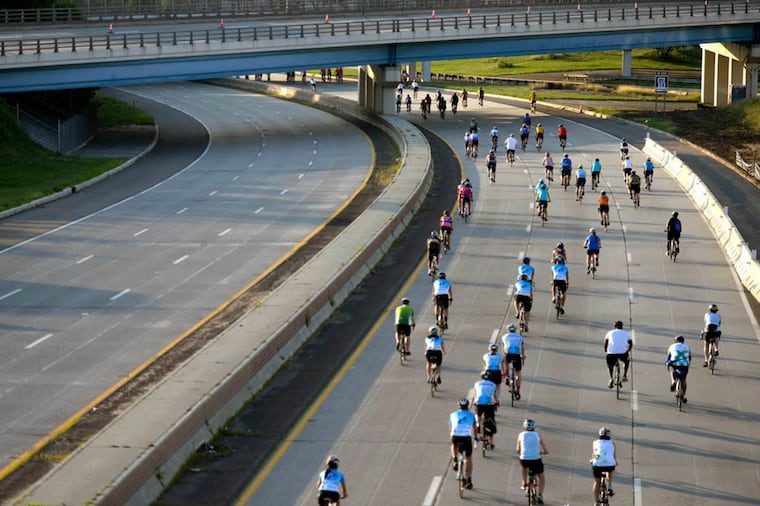 3,300 cyclists begin their ride to the Shore, heading toward Admiral Wilson Blvd, after crossing the Ben Franklin Bridge into New Jersey Sunday, June 14, 2015, participating in the 43rd annual American Cancer Society Bike-a-thon. TOM GRALISH / Staff Photographer