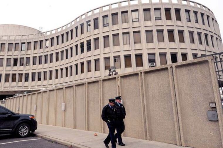 The former police headquarters at Eighth and Race Streets includes a half-block parking lot that could be used as a bus station.