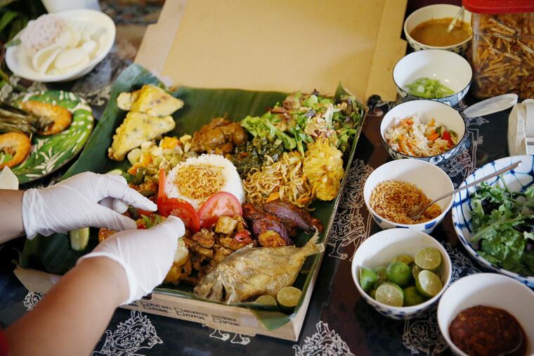 The "Not Pizza" box, a version of a rijsttafel meal, at Hardena in Point Breeze