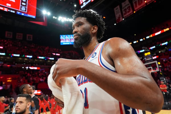 Joel Embiid walks off the court after the Sixers' 106-89 loss to the Heat on Monday in Miami.