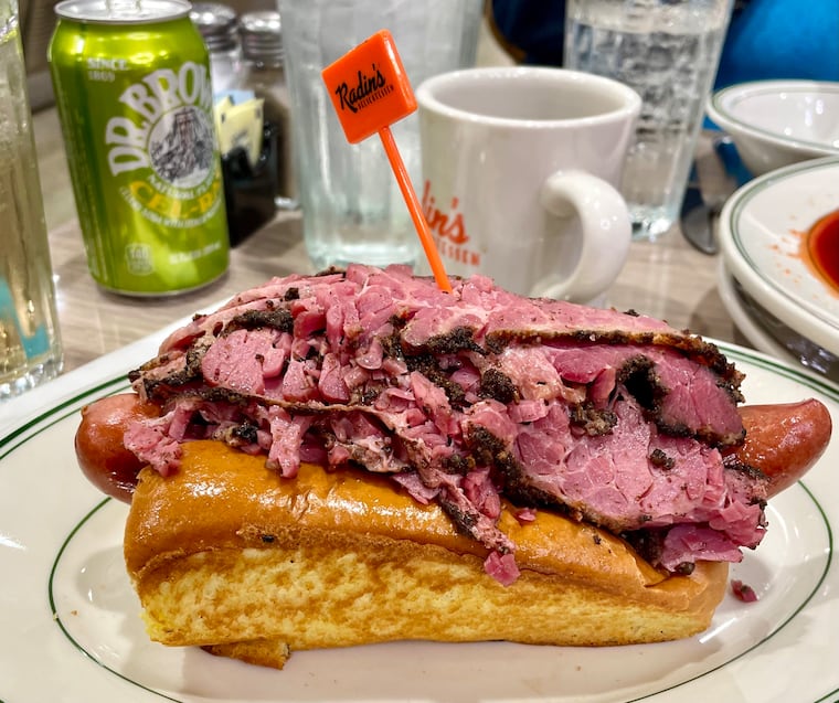 The house pastrami tops a variety of things at Radin's Delicatessen in Cherry Hill, including snappy hot dogs nestled inside house-baked challah buns.