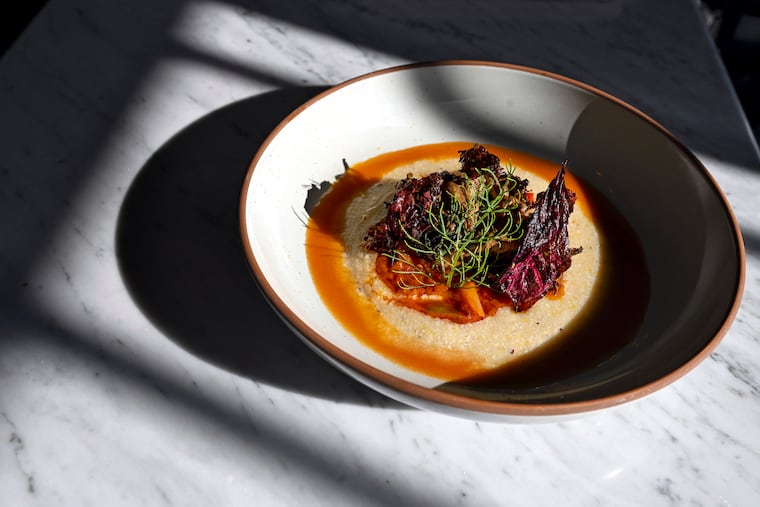 May 11, 2023: The Black Garlic Glazed Maitake with hickory king corn polenta with pepperonata, tomato brodo, and stridolo as served at Ground Provisions, in Dilworthtown, the new country restaurant from Rich Landau and Kate Jacoby.