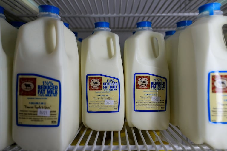 Half gallon containers of milk sit in the refrigerator at Baily's Dairy Farm in West Chester, Pa. on June 14, 2021.