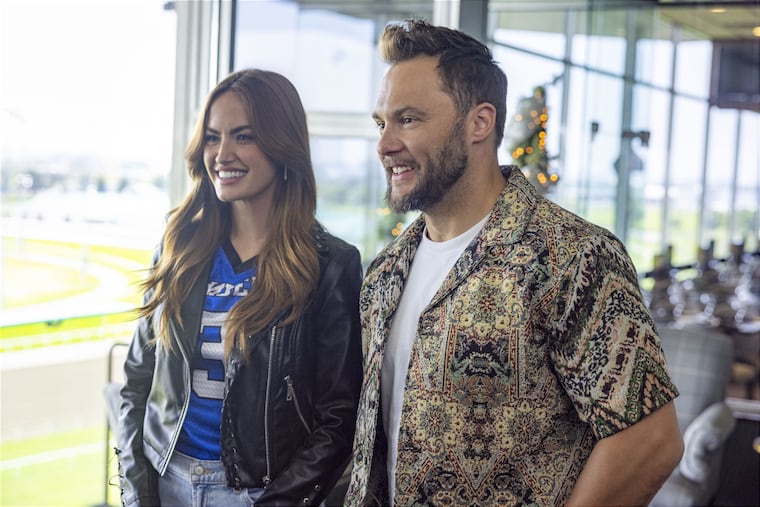 Nicole (Haley Kalil) and Rob Gonville (Dennis Andres) are Lifetime's version of Kylie and Jason Kelce in "Christmas in the Spotlight."