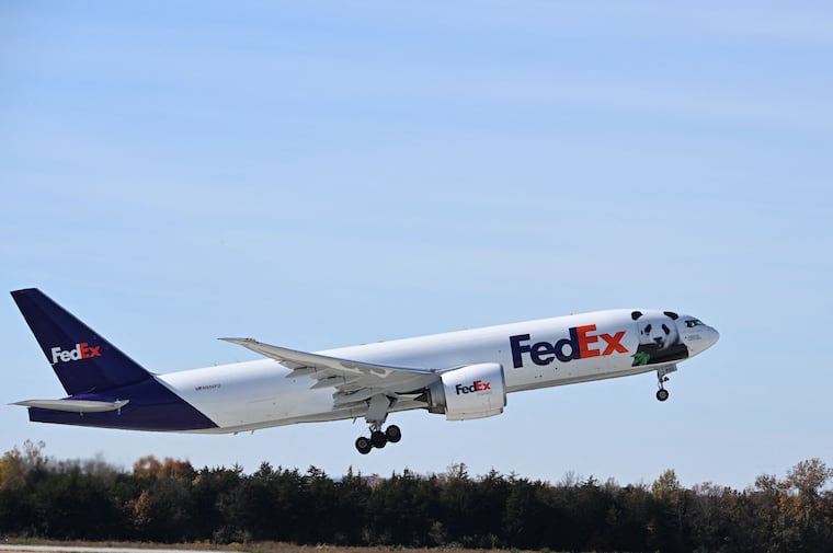 TOPSHOT - The Panda Express takes off as it transports Giant Pandas from the Smithsonian's National Zoo at Dulles International Airport in Dulles, Virginia, on November 8, 2023. All three of the zoo's pandas are leaving for China, bringing at least a temporary end to a decades-old connection between the cuddly animal and the US capital. And while the pandas' departure had been expected due to contractual obligations, many can't help but see the shift as reflective of the growing strains between Beijing and Washington. (Photo by Jim WATSON / AFP) (Photo by JIM WATSON/AFP via Getty Images)