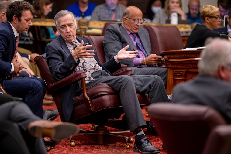 City Councilmember Brian J. O’Neill, second from left, talks ahead of a City Council meeting in 2023.