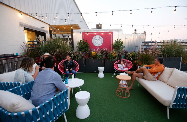 Customers take a seat outside at Sor Ynez in the Norris Square neighborhood on Friday, September 10, 2021.