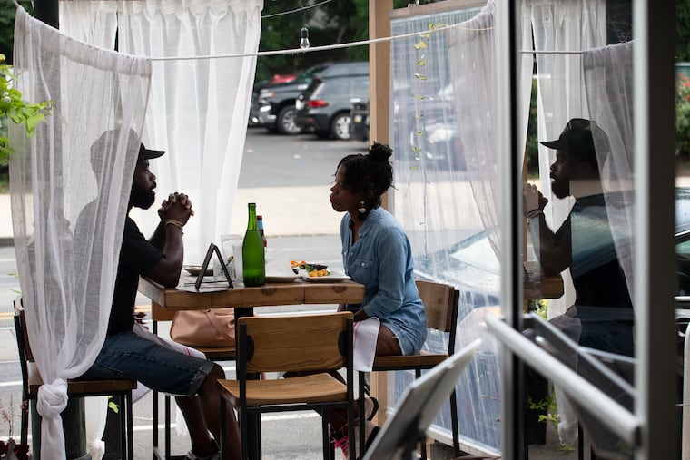 Have your happy hour food and drinks outdoors or indoors at Booker's Bar and Restaurant on Baltimore Ave.