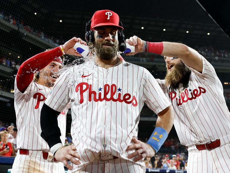 Bryce Harper takes a bath after a game-winning hit against the Astros in August.