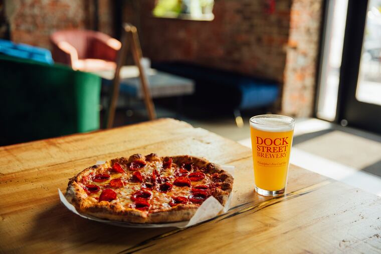 Pepperoni pizza and Dock Street beer at Dock Street Brewery in Philadelphia.