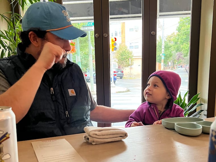 Randy Rucker and daughter, Ruby, at River Twice, her father's restaurant.