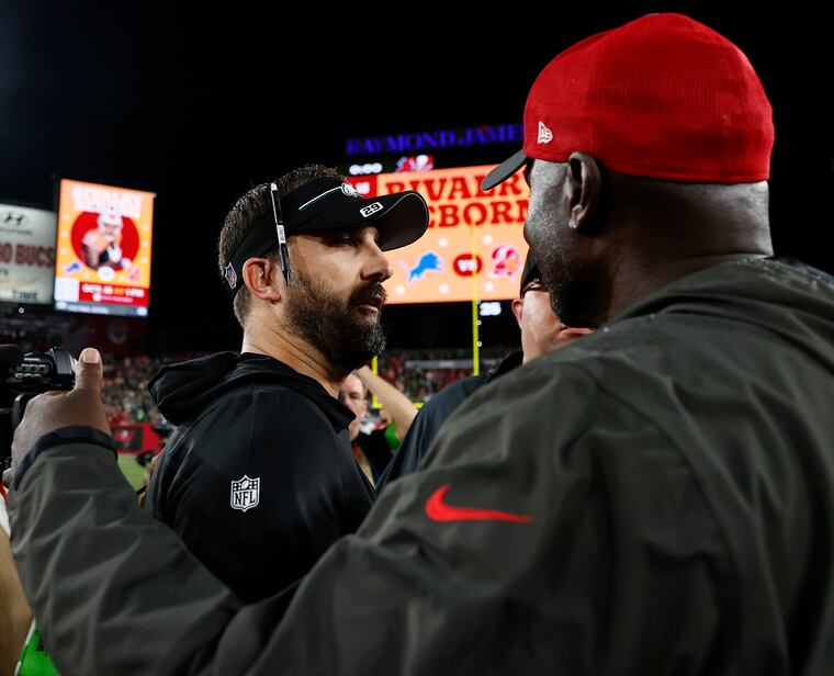 Nick Sirianni meets with Tampa Bay Buccaneers head coach Todd Bowles after the Eagles beat the Buccaneers 25-11 on Sept. 25, 2023.