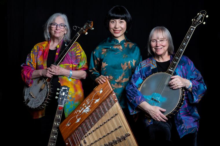 Cathy Fink, left, Chao Tian, and Marcy Marxer make up the trio "From China to Appalachia." Grammy award-winning duo Fink and Marxer teamed up with Tien to combine music from China, Appalachia, and beyond. The group will perform at the 2024 Philadelphia Folk Festival.