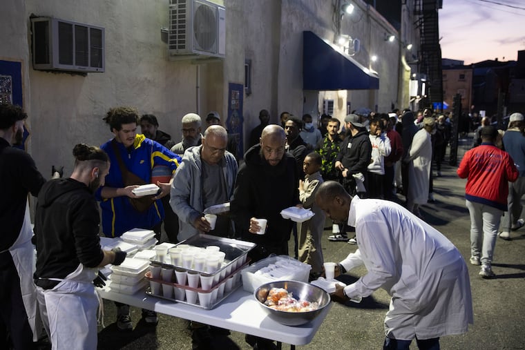 People line up for iftar meals at Al-Aqsa Islamic Society in Philadelphia on Wednesday, March 13, 2024. Ramadan is observed by Muslims with a month of fasting. The fast is broken each day with a nightly meal called iftar.