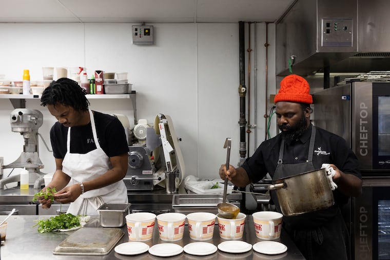 Jamaar Julal, general manager/director of fermentation, and Chef Omar Tate prepare the soup course during a tasting menu dinner called “Untitled,” at Honeysuckle Provisions in Philadelphia, Pa. on Wednesday, Jan. 31, 2024. Chef Omar Tate’s tasting menu features courses with “an emphasis on supporting local black farmers while highlighting black foodways,” according to the website.