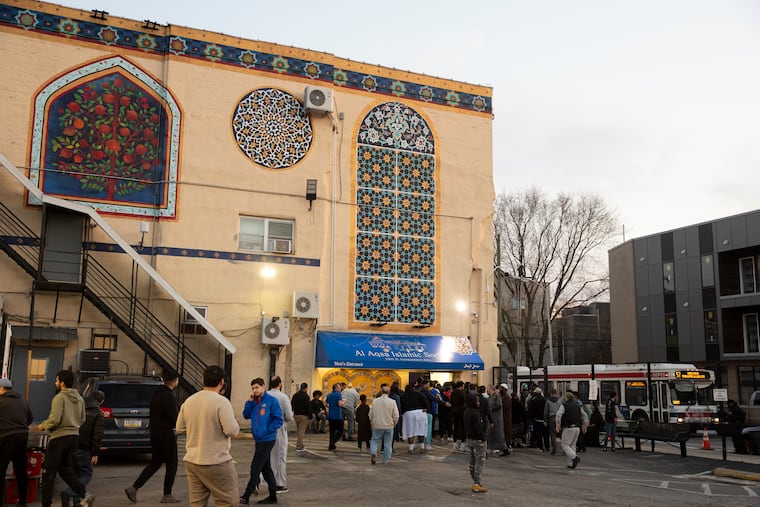 Men enter the mosque for prayer at Al Aqsa Islamic Society in Philadelphia on Wednesday, March 13, 2024. Ramadan is observed by Muslims with a month of fasting. The fast is broken each day with a nightly meal called iftar.