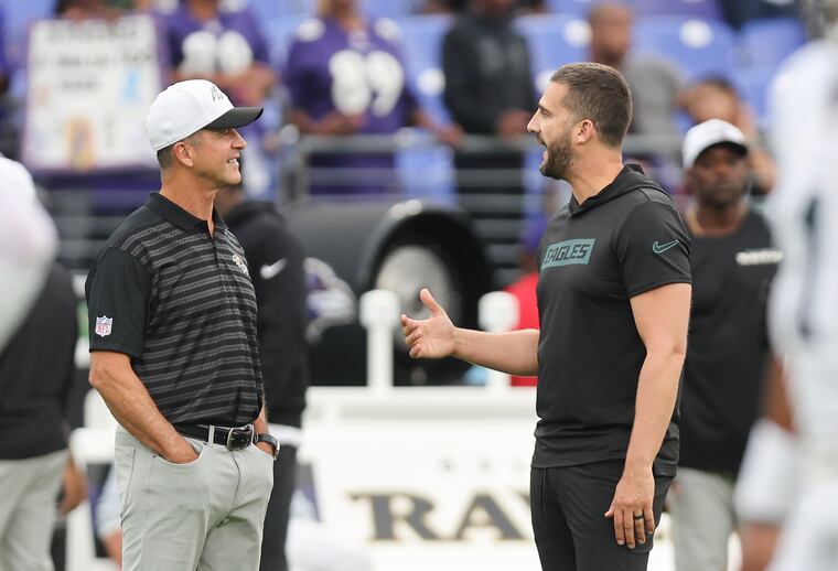 Eagles coach Nick Sirianni (right) talks to Baltimore Ravens coach John Harbaugh during team warm ups before their preseason game against the Ravens at M&T Bank Stadium on Aug. 9.