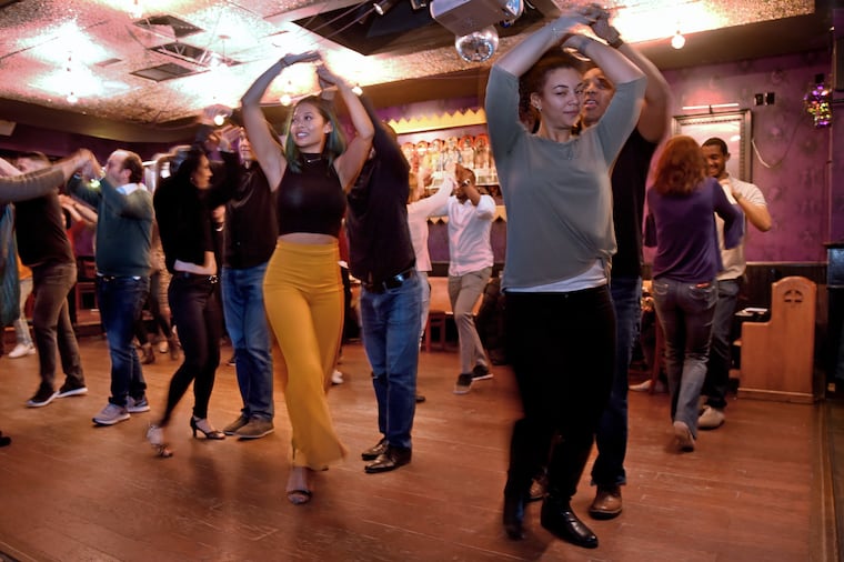 Tuesday night free salsa dancing session at Lucha Cartel with instructors from Estilo Dance Studio.