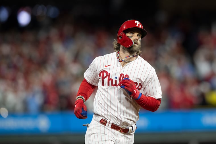 Bryce Harper rounds the bases after his first inning home run in Game 1. 