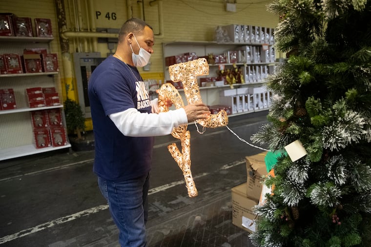 Jose Padin bought the last two strings of letters spelling "joy" from a display tree at Kindy’s Christmas Factory Outlet Store in 2020.