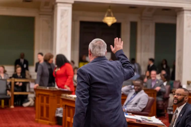 Mayor Jim Kenney waves as he leaves Council chambers after making a visit during the last City Council meeting of the year on Dec. 14.