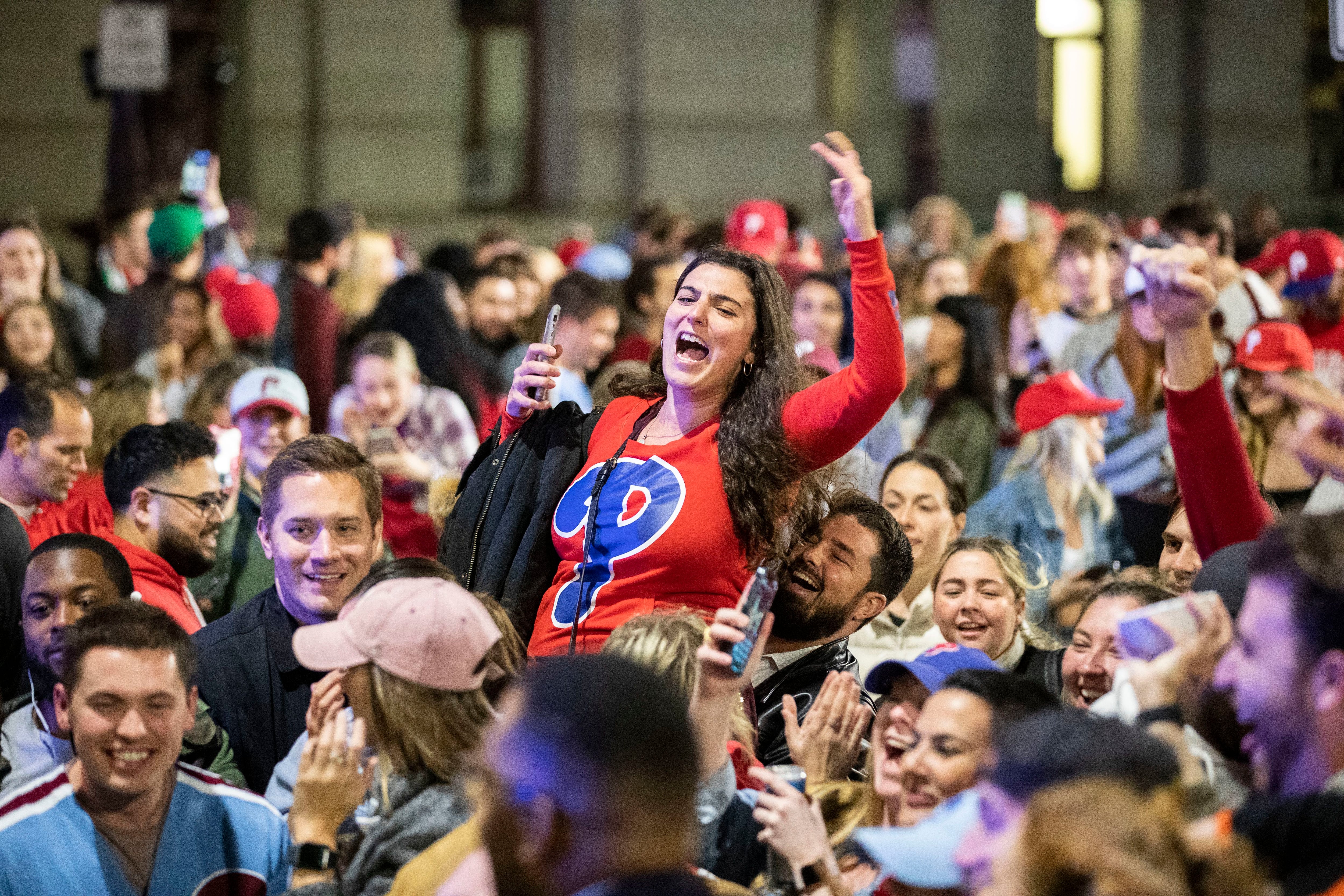 Phillies fans celebrate World Series berth climbing greased poles