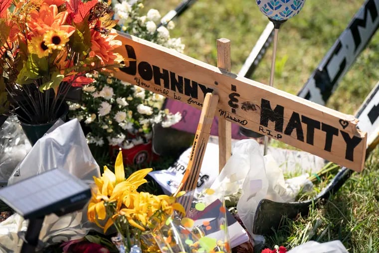 A memorial for Johnny and Matthew Gaudreau, who died last week when they were struck by a suspected drunk driver while riding bicycles, is shown in Salem County, N.J.