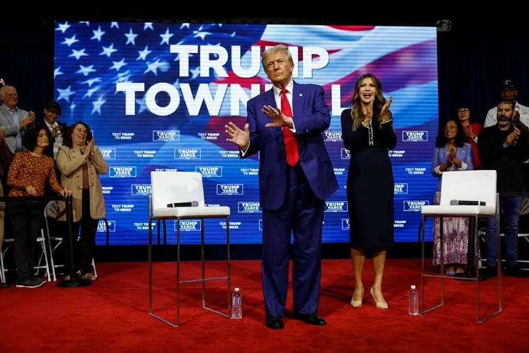 Former President Donald Trump stands for a town hall meeting with South Dakota Governor Kristi Noem in Oaks on Monday, Oct. 14.