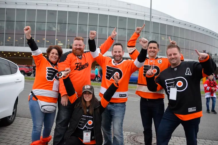 Flyers fans turned out in force in Prague for the season opener at O2 Arena. Kneeling:  Amanda DiStefano of Broomall.  Standing and kneeling, from left to right:  Grace DiStefano of Broomall; Tim Cavanaugh of Springfield; Brian Dikun of West Cheste; Matt Plagens of Williamsport; and Christian Off of Lansdale.