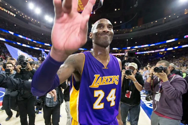 The Los Angeles Lakers' Kobe Bryant bites his jersey after the Philadelphia  76ers took the lead late in the fourth quarter at the Wells Fargo Center in  Philadelphia, Pennsylvania, Monday, February 6
