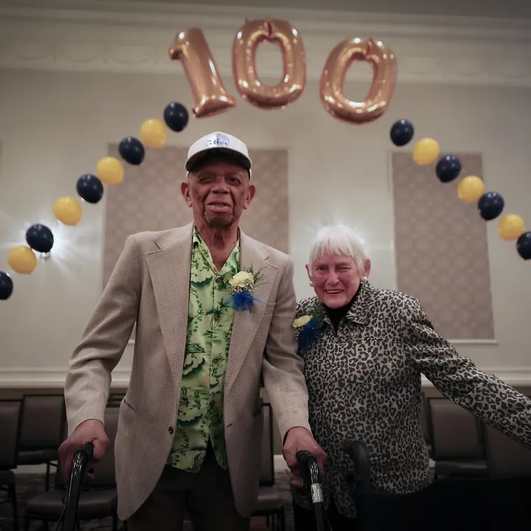 Herman Whilby (left), 106, and Sarah Narvel (right), 103, pose under a balloon arch during the annual Delaware County Centenarian Celebration in Drexel Hill on Thursday, May 16, 2024.