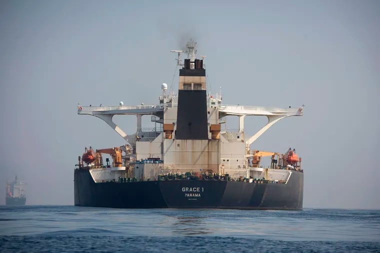 A stern view of the Grace 1 super tanker in the British territory of Gibraltar, Thursday, Aug. 15, 2019, seized last month in a British Royal Navy operation off Gibraltar.  The United States moved on Thursday to halt the release of the Iranian supertanker Grace 1, detained in Gibraltar for breaching EU sanctions on oil shipments to Syria, thwarting efforts by authorities in London and the British overseas territory to defuse tensions with Tehran. (AP Photo/Marcos Moreno)