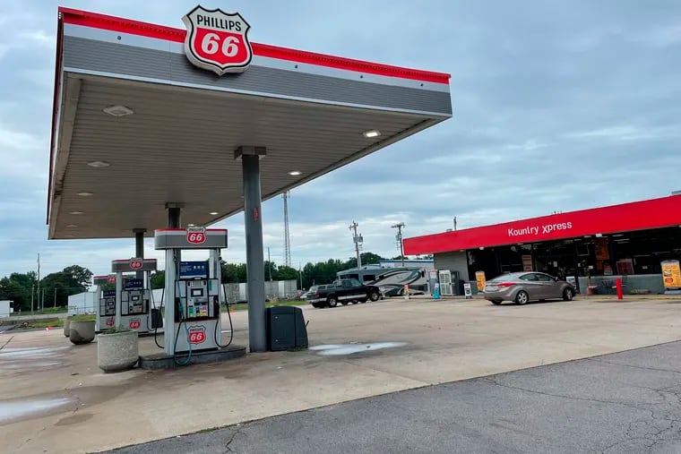 A car is parked outside the Kountry Xpress convenience store in Mulberry, Ark. Three law enforcement officers have been suspended after a video posted on social media showed a South Carolina man being held down on the ground and beaten by police.