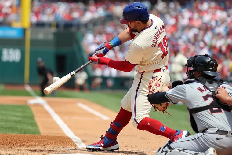 Phillies designated hitter Kyle Schwarber hits a solo home run in the first inning against Cleveland on July 28.