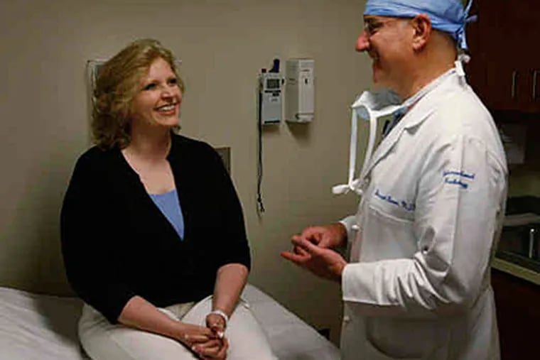 Nasha Smith visits Joseph Bonn, the doctor who treated her. &quot;The procedure was so simple, yet life-changing,&quot; she said. (Michael S. Wirtz / Staff)