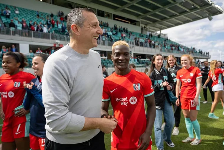 Vlatko Andonovski is back in his adopted hometown of Kansas City as manager of the Current, the top team in the NWSL this season. Striker Temwa Chawinga (shaking hands with him) is a big reason for the team's success.