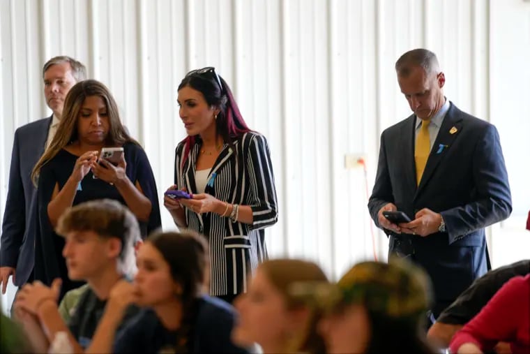 Lynne Patton, Laura Loomer and Corey Lewandowski watch as Republican presidential nominee former President Donald Trump visits the Shanksville Volunteer Fire Company in Shanksville, Pa., on Wednesday, Sept. 11, 2024.