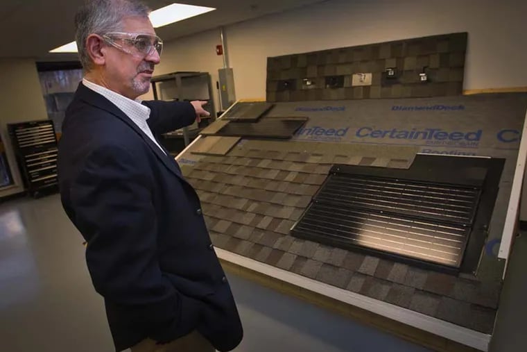 Minas Apelian, Vice President for Research and Development for CertainTeed and Global Director External Venturing at St. Gobain Malvern Innovation Center, stands next to an Apollo II solar integrated roof panel on Mar. 9, 2015 at 18 Moores Road, in Malvern, Pa. (Alejandro A. Alvarez / Staff Photographer)